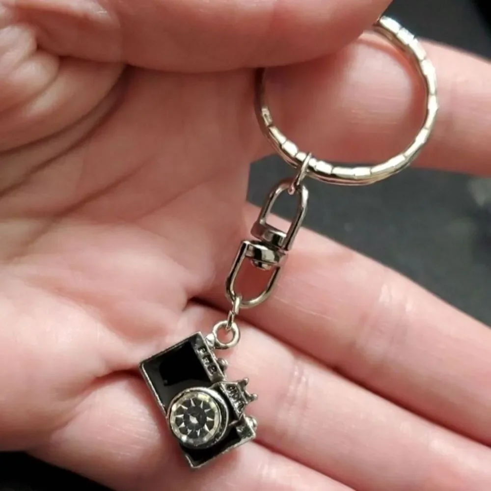 Silver tone camera key fob